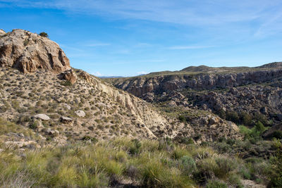 Scenic view of rocky mountains against sky