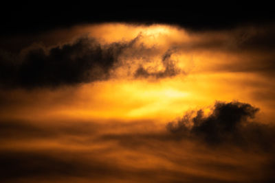 Low angle view of dramatic sky during sunset