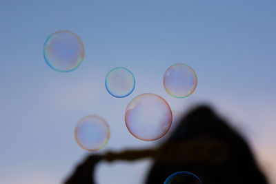 Close-up of bubbles against blue background