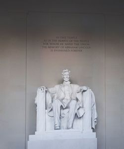 Statue against wall