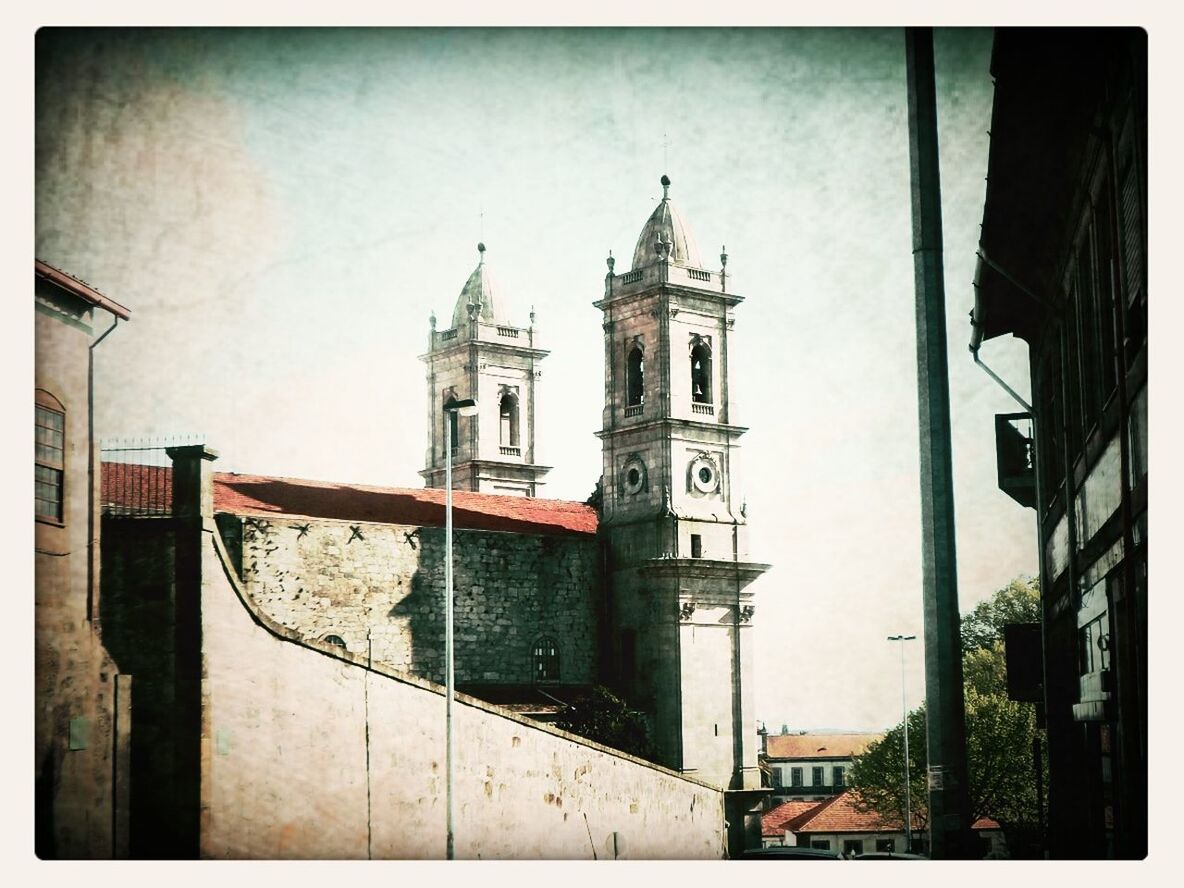 building exterior, architecture, built structure, church, religion, place of worship, spirituality, transfer print, low angle view, auto post production filter, cathedral, sky, cross, clock tower, city, day, steeple, tower