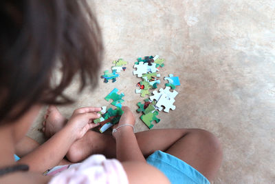 High angle view of woman playing with umbrella