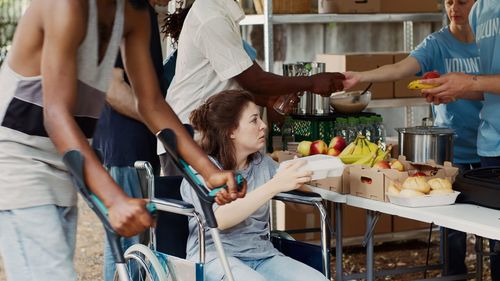 Midsection of woman preparing food in workshop