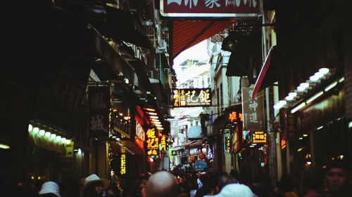 People walking on street at night