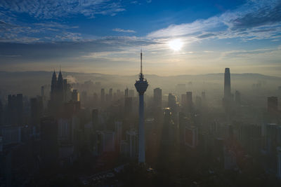 View of buildings in city during sunset