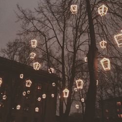 Low angle view of illuminated lights at night