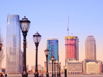 Modern buildings in city against clear sky