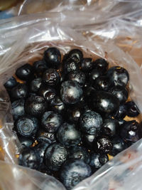 High angle view of blackberries in container on table