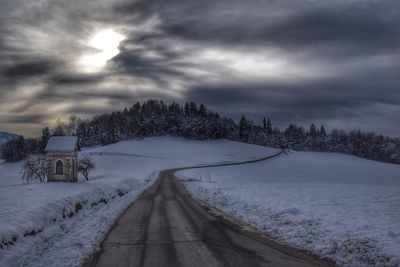 Scenic view of snow covered landscape against sky