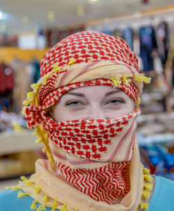 Close-up portrait of woman wearing hat