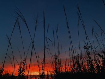 Silhouette landscape against sky during sunset