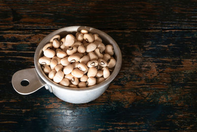 High angle view of pills in bowl on table