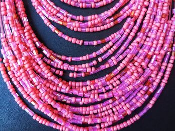 Close-up of beaded necklaces on table