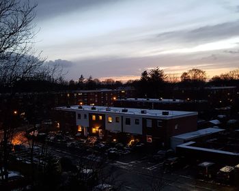 High angle view of houses against sky during sunset