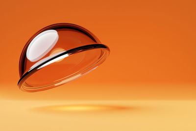 Close-up of eyeglasses on yellow background