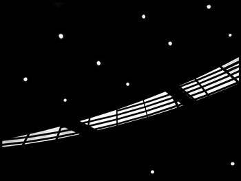 Low angle view of illuminated moon at night