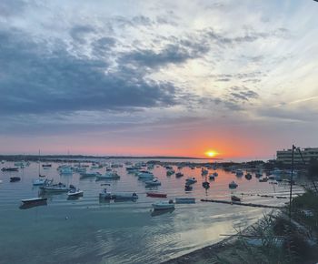 High angle view of boats in sea during sunset