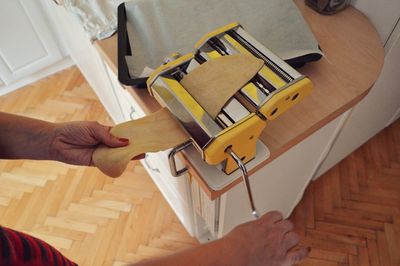 Cropped image of woman making food at home