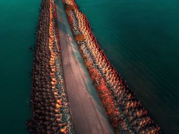 High angle view of pier in sea during sunset