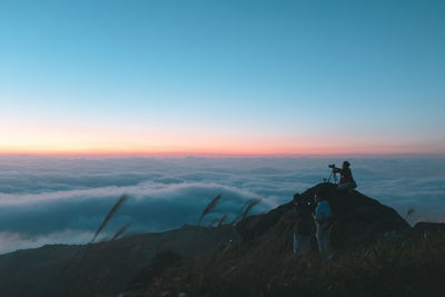 Scenic view of landscape against sky at sunset