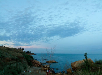 Scenic view of bay against sky