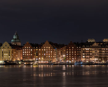 Illuminated buildings in city at night