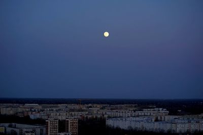 Aerial view of townscape against clear sky at night