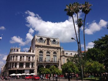 Low angle view of historical building against cloudy sky