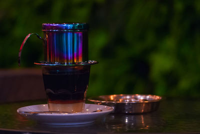 Close-up of coffee on table with serving style called vietnamese dripping 