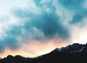 Low angle view of silhouette mountain against sky during sunset