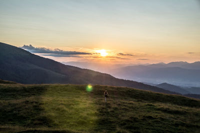 Scenic view of landscape against sky during sunset