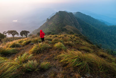 High angle view of woman on mountain against sky