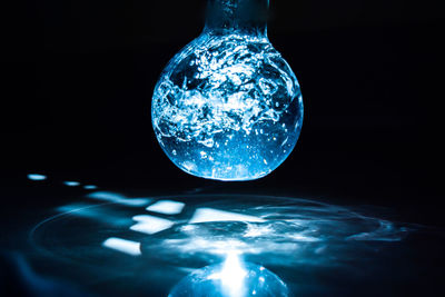 Close-up of water in flask over table