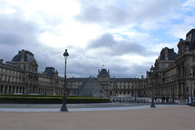 Low angle view of historical building against cloudy sky