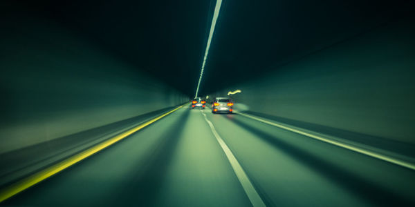 Cars on road at night