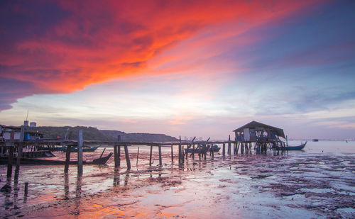 Scenic view of beach against sky during sunset