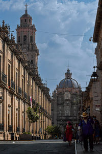 Low angle view of historic building against cloudy sky