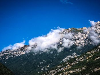 Low angle view of majestic mountains against sky