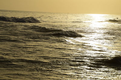 Scenic view of sea against clear sky during sunset