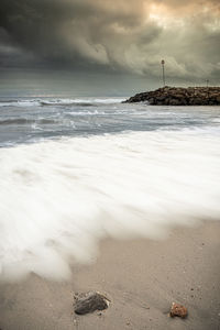 Scenic view of beach against sky