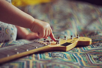 Close-up of hands playing piano