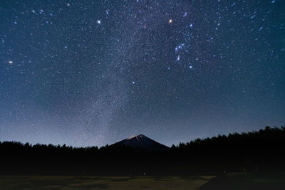 Scenic view of star field against sky at night