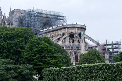 View of historical building notre dame ruins against sky