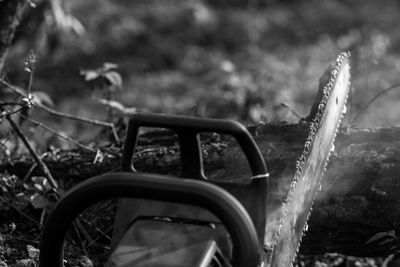 Close-up of abandoned car on field