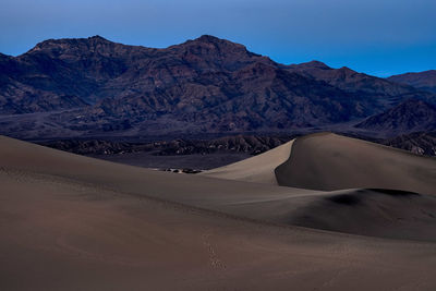 Scenic view of desert against sky