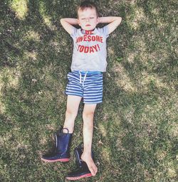 Portrait of boy standing on field