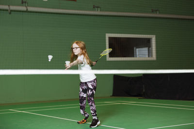 Girl with artificial leg playing badminton