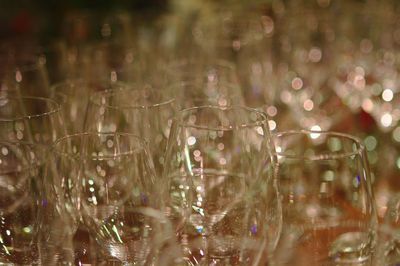 Close-up of wineglasses on table