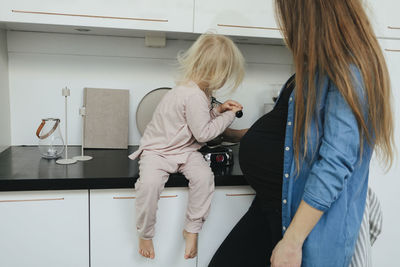 Mother and daughter in kitchen