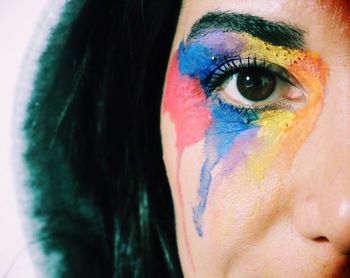 Close-up portrait of mid adult woman with face paint